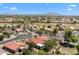 A neighborhood with well-maintained streets and community with views of a golf course and mountains at 5024 S Citrus Ct, Gilbert, AZ 85298