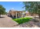 A scenic backyard showing a covered patio and artificial grass at 5024 S Citrus Ct, Gilbert, AZ 85298