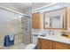 Bathroom features a glass shower enclosure, ample vanity storage, and natural light at 5024 S Citrus Ct, Gilbert, AZ 85298
