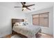 Comfortable bedroom with a wooden frame bed and natural light at 5024 S Citrus Ct, Gilbert, AZ 85298