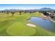 A nice aerial view of the lush green golf course, pond and sand trap in the community at 5024 S Citrus Ct, Gilbert, AZ 85298
