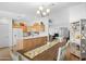 Open kitchen area with wood cabinets, white countertops, and a cozy dining area nearby at 5024 S Citrus Ct, Gilbert, AZ 85298