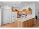 Functional kitchen with wooden cabinets, an island, and modern appliances at 5024 S Citrus Ct, Gilbert, AZ 85298
