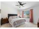 Comfortable main bedroom with a large bed, stylish decor, and a ceiling fan at 5024 S Citrus Ct, Gilbert, AZ 85298