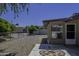 Well-maintained backyard with stone landscaping, concrete patio, and a privacy fence at 5148 E Edgewood Cir, Mesa, AZ 85206