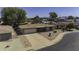 An elevated shot of the house with a garage and minimal desert landscaping in the front yard at 5148 E Edgewood Cir, Mesa, AZ 85206