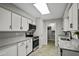 Modern kitchen featuring white cabinets, granite countertops, and stainless steel appliances at 5148 E Edgewood Cir, Mesa, AZ 85206