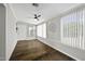Bright sunroom featuring wood floors, large windows, and ample natural light at 5148 E Edgewood Cir, Mesa, AZ 85206