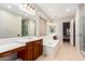 Bright bathroom featuring double vanity, soaking tub, and glass shower at 5607 W Alyssa Ln, Phoenix, AZ 85083