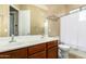 Neutral bathroom with double sink vanity and shower-tub combo at 5607 W Alyssa Ln, Phoenix, AZ 85083