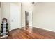 Bright and spacious spare bedroom with dark wood floors at 5607 W Alyssa Ln, Phoenix, AZ 85083
