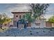 Stetson Valley community entrance with charming water wheel and stonework at 5607 W Alyssa Ln, Phoenix, AZ 85083