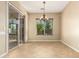 Bright dining area with sliding glass door, chandelier, and natural light at 5607 W Alyssa Ln, Phoenix, AZ 85083