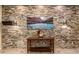 Inviting entryway with stone accent wall, console table, and stylish decor at 5607 W Alyssa Ln, Phoenix, AZ 85083