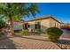 Exterior view of house with mature landscaping, paver patio and covered hot tub at 5607 W Alyssa Ln, Phoenix, AZ 85083