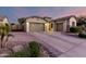 Charming home with three-car garage, stone accents, and well-manicured landscaping at 5607 W Alyssa Ln, Phoenix, AZ 85083