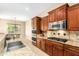 Modern kitchen with stainless steel appliances, granite countertops, and ample cabinet space at 5607 W Alyssa Ln, Phoenix, AZ 85083