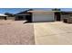 Charming single-story home features a two-car garage and low-maintenance desert landscaping at 5634 W Puget Ave, Glendale, AZ 85302