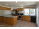 Well-equipped kitchen with stainless steel appliances, oak cabinets, and ample counter space at 5634 W Puget Ave, Glendale, AZ 85302