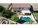 Aerial view of a backyard featuring a private pool, covered patio, and desert landscaping at 6014 W Oberlin Way, Phoenix, AZ 85083