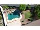 Aerial view of a swimming pool with landscaping, rock accents, and grassy play area at 6014 W Oberlin Way, Phoenix, AZ 85083