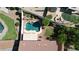 Aerial view of a private backyard pool with natural rock features and a grassy play area at 6014 W Oberlin Way, Phoenix, AZ 85083