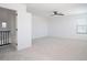 Spacious empty room with neutral carpeting, ceiling fan and window with blinds at 6014 W Oberlin Way, Phoenix, AZ 85083