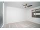 Bright bedroom with neutral carpet, large window and white walls at 6014 W Oberlin Way, Phoenix, AZ 85083