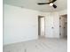 Spacious bedroom with carpet, ceiling fan, and multiple closets and doorways at 6014 W Oberlin Way, Phoenix, AZ 85083