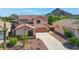 Charming two-story home with a well-maintained desert landscaped front yard and a spacious driveway at 6014 W Oberlin Way, Phoenix, AZ 85083