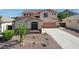 Charming two-story home boasts a well-manicured lawn, desert landscaping, and inviting front entrance at 6014 W Oberlin Way, Phoenix, AZ 85083