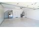 Clean and organized garage featuring epoxy flooring and ample storage at 6014 W Oberlin Way, Phoenix, AZ 85083