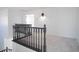 Upstairs landing features neutral carpet, white walls and dark wood railing at 6014 W Oberlin Way, Phoenix, AZ 85083