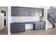 Custom kitchen boasting elegant cabinetry, sleek countertops, and easy access to the staircase at 6014 W Oberlin Way, Phoenix, AZ 85083