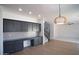 Stylish kitchen includes custom cabinetry, stainless steel appliances, and flows to a spacious dining area at 6014 W Oberlin Way, Phoenix, AZ 85083