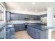 Bright kitchen showcases gray cabinetry, stainless steel appliances, and a large center island at 6014 W Oberlin Way, Phoenix, AZ 85083