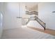 Spacious and airy living room with staircase, carpet, wood flooring, and a modern chandelier at 6014 W Oberlin Way, Phoenix, AZ 85083
