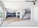Open-concept living space and kitchen with stainless steel appliances and staircase at 6014 W Oberlin Way, Phoenix, AZ 85083