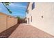 Narrow side yard of a home, featuring a gated entrance, offering privacy and security at 6014 W Oberlin Way, Phoenix, AZ 85083