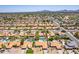 Wide aerial shot captures the community, highlighting red tile roofs, backyard pools, desert landscaping and quiet residential streets at 6017 E Kathleen Rd, Scottsdale, AZ 85254