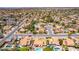 Aerial of a community with homes featuring red tile roofs, backyard pools, desert landscaping, and quiet streets at 6017 E Kathleen Rd, Scottsdale, AZ 85254