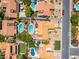 An aerial view shows homes with pools and landscaping in a suburban neighborhood at 6017 E Kathleen Rd, Scottsdale, AZ 85254