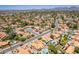 Aerial shot of a community features homes with red tile roofs, pools, desert landscaping, and quiet streets at 6017 E Kathleen Rd, Scottsdale, AZ 85254