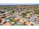 Sprawling neighborhood featuring lush landscaping, terra cotta rooftops, and sparkling swimming pools at 6017 E Kathleen Rd, Scottsdale, AZ 85254