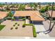 Aerial view of the house showcasing its landscaped yard, driveway, and charming curb appeal at 6017 E Kathleen Rd, Scottsdale, AZ 85254