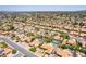 Community aerial view features homes with red tile roofs, pools, desert landscaping and quiet residential streets at 6017 E Kathleen Rd, Scottsdale, AZ 85254