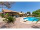 View of the sparkling pool with diving board and sunny backyard area at 6017 E Kathleen Rd, Scottsdale, AZ 85254