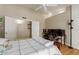 Comfortable bedroom features a closet, ceiling fan, and desk area at 6017 E Kathleen Rd, Scottsdale, AZ 85254