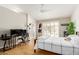Bright bedroom featuring a ceiling fan, desk, and ample natural light at 6017 E Kathleen Rd, Scottsdale, AZ 85254