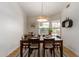 Cozy dining room with a stylish table set, modern light fixture, and ample natural light at 6017 E Kathleen Rd, Scottsdale, AZ 85254